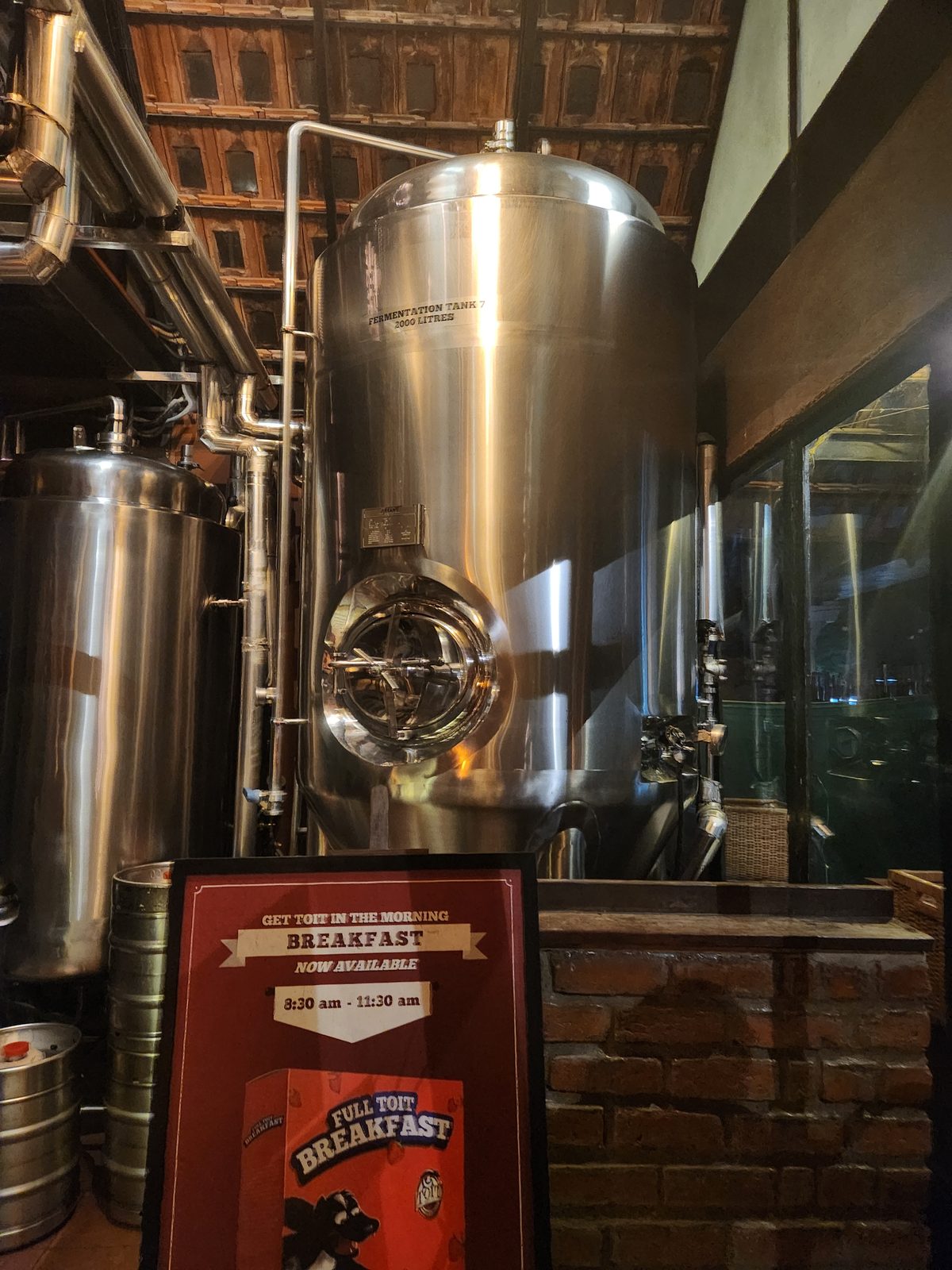 Inside a Bengaluru microbrewery with large steel fermentation tanks