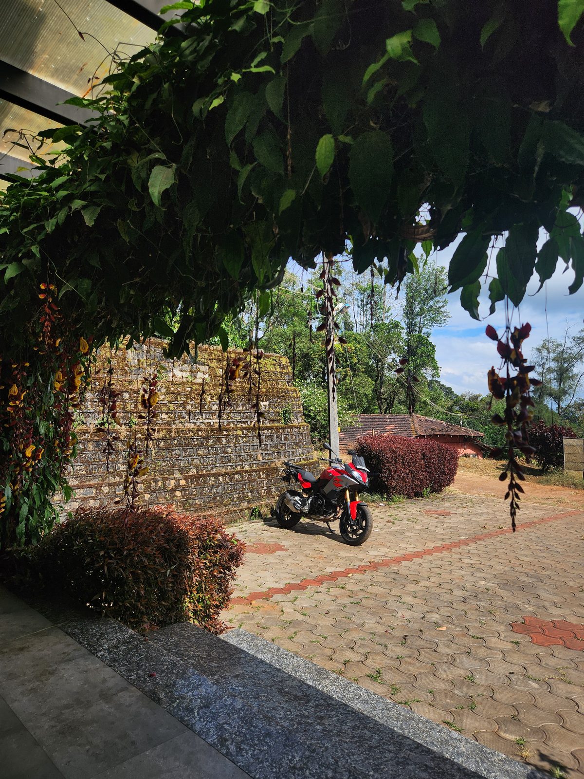 The motorcycle at a green, scenic spot near Chikkamagaluru