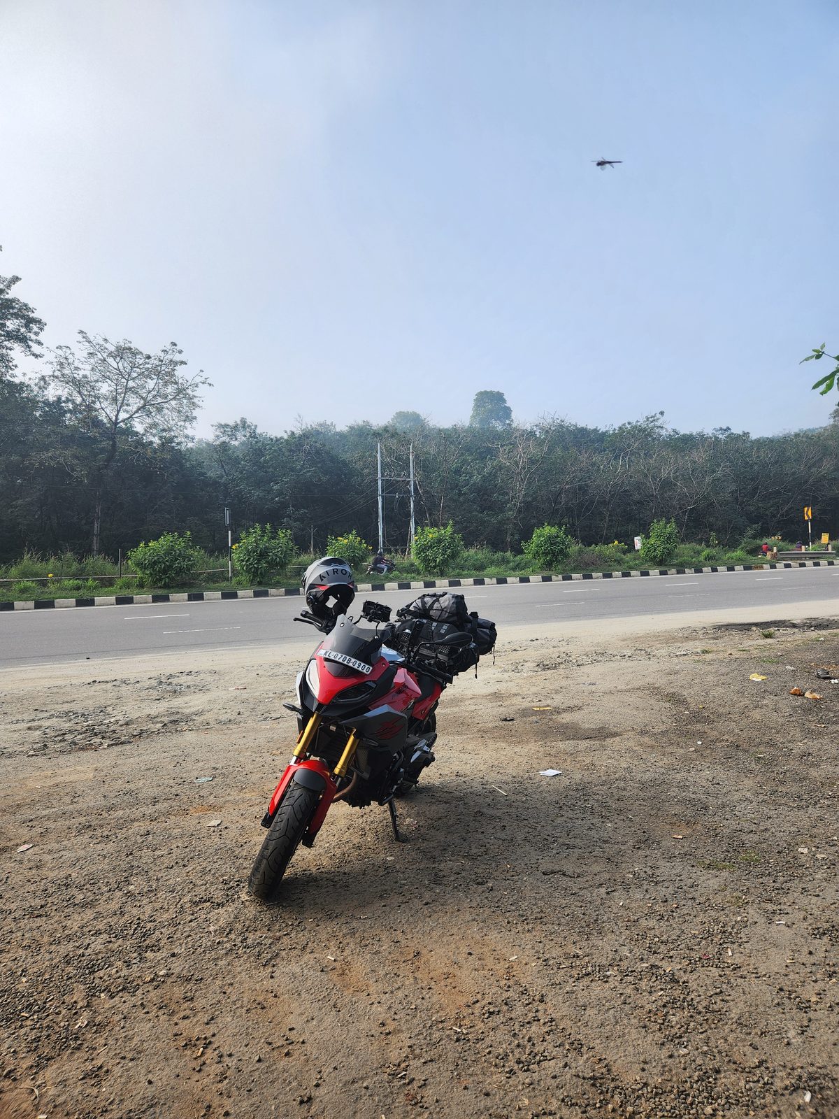 The BMW F900XR parked on the roadside on the highway out of Cochin