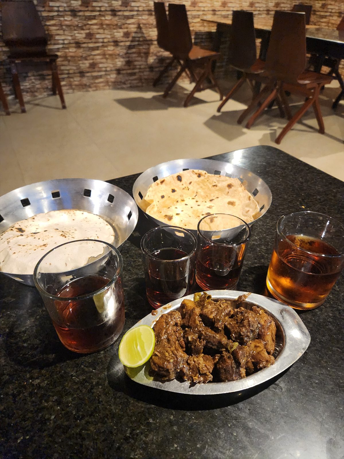 A spread of Coorg-style pork dishes on a table