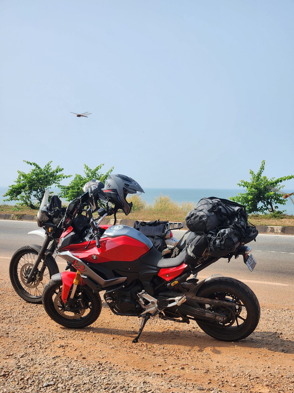 The motorcycle parked on a roadside on the ride from Goa towards Coorg