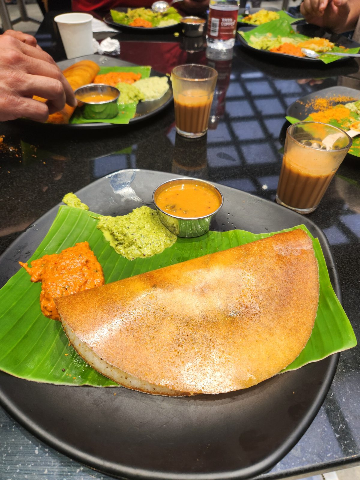 A ghee-roast dosa with chutneys and filter coffee at The Rameshwaram Cafe
